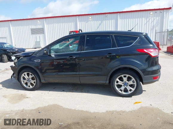 2013 Ford Escape SEL with VIN 1FMCU9HX1DUB97939, listed as a IAAI auction lot 42293561 with 196,951 mi miles and . Bid and sale history available at DreamBid. Image 15.