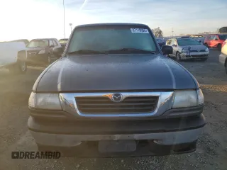 1999 Mazda B-Series 2WD Truck SE with VIN 4F4YR16V7XTM09808, listed as a Copart auction lot 87118994 with 117,698 mi miles and Clean Title. Bid and sale history available at carsss.com. Image 5.