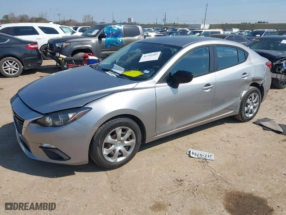 2014 Mazda Mazda3 i SV with VIN JM1BM1T77E1184656, listed as a IAAI auction lot 41703402 with 57,025 mi miles. Bid and sale history available at carsss.com. Image 2.