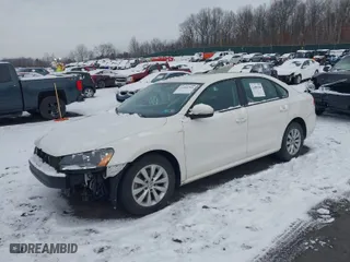 2014 Volkswagen Passat Wolfsburg Ed with VIN 1VWAT7A33EC091975, listed as a IAAI auction lot 41489344 with 97,306 mi miles. Bid and sale history available at carsss.com. Image 2.