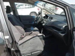2013 Honda Fit with VIN JHMGE8H37DC048529, listed as a IAAI auction lot 42011202 with 255,113 mi miles. Bid and sale history available at carsss.com. Image 5.