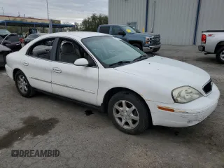 2001 Mercury Sable with VIN 1MEFM53U31A629921, listed as a Copart auction lot 77173754 with 122,769 mi miles and Salvage title. Bid and sale history available at DreamBid. Image 4.