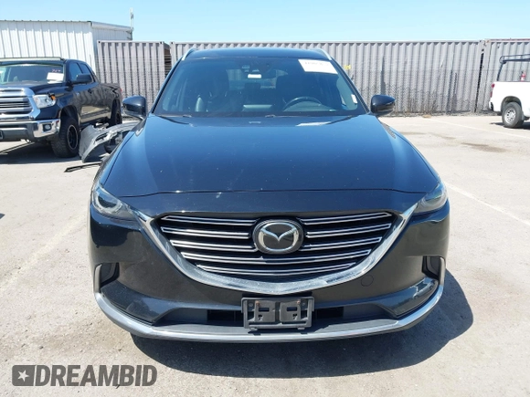 2016 Mazda CX-9 Grand Touring with VIN JM3TCBDY4G0113693, listed as a IAAI auction lot 41965857 with 152,403 mi miles and . Bid and sale history available at DreamBid. Image 13.