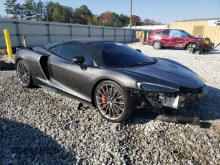 2021 McLaren GT z VIN SBM22GCA8MW001374, wystawiony jako Copart lot #82147064 z przebiegiem 32 562 mil mil oraz Nie do naprawy. Historia ofert i sprzedaży dostępna na DreamBid. Obrazek 4.