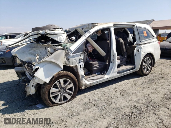 2015 Honda Odyssey Touring Elite z VIN 5FNRL5H90FB033511, wystawiony jako Copart lot #67718683 z przebiegiem Nie podano mil oraz Szkoda całkowita • Salvage title. Historia ofert i sprzedaży dostępna na DreamBid. Obrazek 1.