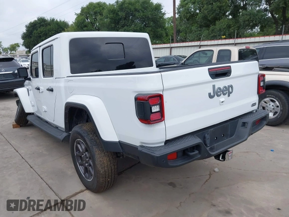 2021 Jeep Gladiator High Altitude with VIN 1C6HJTFG8ML551570, listed as a IAAI auction lot 42229235 with 56,959 mi miles and . Bid and sale history available at DreamBid. Image 3.