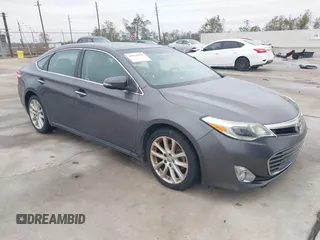 2014 Toyota Avalon Limited with VIN 4T1BK1EB2EU112104, listed as a IAAI auction lot 40951962 with 106,628 mi miles. Bid and sale history available at carsss.com. Image 1.