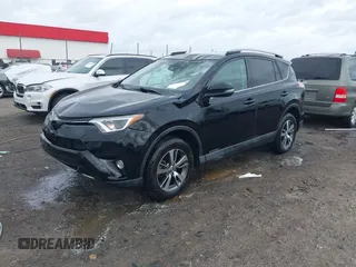 2018 Toyota RAV4 XLE with VIN 2T3WFREV9JW412755, listed as a IAAI auction lot 41889960 with 216,451 mi miles and . Bid and sale history available at carsss.com. Image 18.