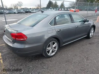 2014 Volkswagen Passat SE w/Sunroof with VIN 1VWBS7A32EC057808, listed as a IAAI auction lot 41208311 with 91,362 mi miles. Bid and sale history available at carsss.com. Image 4.