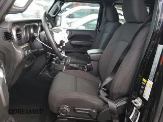 2023 Jeep Wrangler Sport with VIN 1C4HJXDN9PW638737, listed as a Copart auction lot 71367284 with 12,054 mi miles and Salvage Title. Bid and sale history available at DreamBid. Image 7.