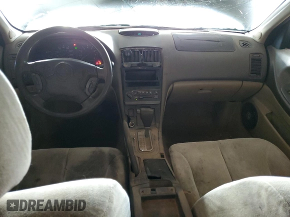 2001 Nissan Maxima GXE with VIN JN1CA31D41T809212, listed as a Copart auction lot 57845405 with 244,502 mi miles and Salvage title. Bid and sale history available at DreamBid. Image 8.