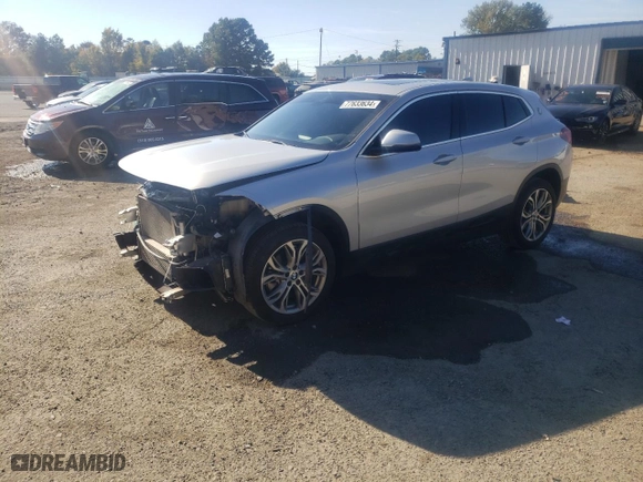 2022 BMW X2 xDrive28i with VIN WBXYJ1C02N5U11799, listed as a Copart auction lot 77633634 with 59,411 mi miles and Salvage Title. Bid and sale history available at carsss.com. Image 1.