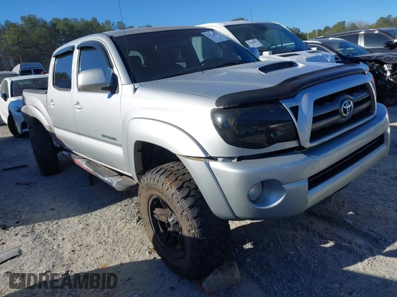 2009 Toyota Tacoma z VIN 5TELU42N09Z596810, wystawiony jako IAAI lot #41673552 z przebiegiem 169 044 mil mil oraz . Historia ofert i sprzedaży dostępna na DreamBid. Obrazek 1.