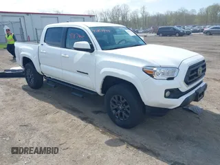 2023 Toyota Tacoma SR with VIN 3TMCZ5AN2PM642205, listed as a IAAI auction lot 42167945 with 10,595 mi miles and . Bid and sale history available at DreamBid. Image 1.