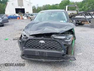 2022 Toyota Corolla Cross L with VIN 7MUAAABG6NV032964, listed as a IAAI auction lot 42458401 with 33,777 mi miles and . Bid and sale history available at DreamBid. Image 12.
