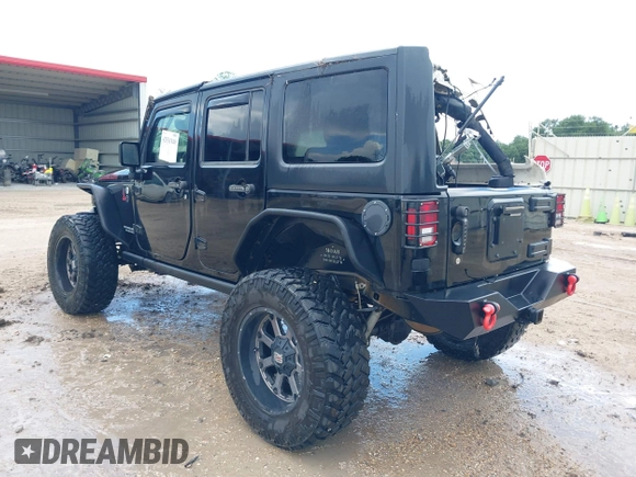 2015 Jeep Wrangler Unlimited Rubicon Hard Rock with VIN 1C4HJWFG0FL674700, listed as a IAAI auction lot 42511949 with 138,370 mi miles and . Bid and sale history available at DreamBid. Image 3.