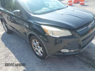 2013 Ford Escape SE z VIN 1FMCU9GX5DUA19887, wystawiony jako IAAI lot #42580986 z przebiegiem 169 407 mil mil oraz . Historia ofert i sprzedaży dostępna na DreamBid. Obrazek 18.