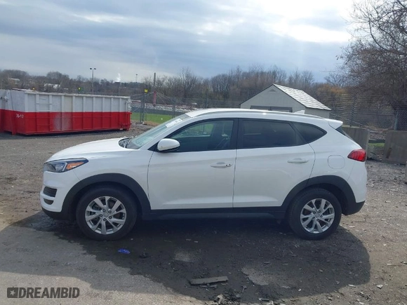 2019 Hyundai Tucson Value with VIN KM8J3CA42KU013032, listed as a IAAI auction lot 41880465 with 51,332 mi miles. Bid and sale history available at carsss.com. Image 14.