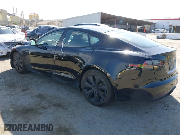 2023 Tesla Model S with VIN 5YJSA1E54PF531021, listed as a IAAI auction lot 42014104 with Not provided miles and . Bid and sale history available at DreamBid. Image 3.