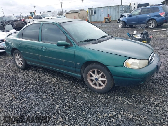 1999 Ford Contour SE Fleet with VIN 1FAFP66L3XK227522, listed as a IAAI auction lot 41702873 with 140,926 mi miles. Bid and sale history available at carsss.com. Image 1.