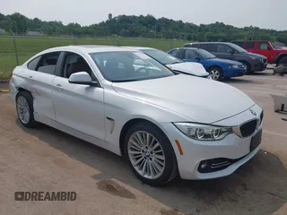 2015 BMW 4 Series 428i xDrive with VIN WBA4A7C51FD415440, listed as a IAAI auction lot 42378459 with 116,445 mi miles and . Bid and sale history available at DreamBid. Image 1.