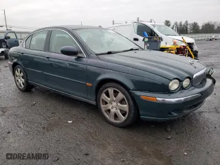 2004 Jaguar X-Type with VIN SAJEA51C84WD57149, listed as a Copart auction lot 82661344 with 146,574 mi miles and Salvage Title. Bid and sale history available at carsss.com. Image 4.