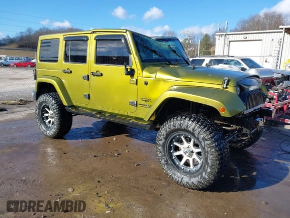 2007 Jeep Wrangler Unlimited Sahara with VIN 1J4GA59187L189519, listed as a IAAI auction lot 41204036 with 165,428 mi miles and . Bid and sale history available at DreamBid. Image 1.