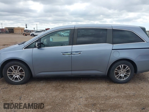 2011 Honda Odyssey EX-L with VIN 5FNRL5H64BB085479, listed as a IAAI auction lot 42404637 with 185,624 mi miles and . Bid and sale history available at DreamBid. Image 14.