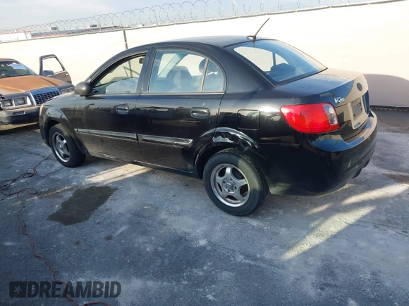 2010 Kia Rio LX with VIN KNADH4A33A6668719, listed as a IAAI auction lot 41777544 with 124,400 mi miles. Bid and sale history available at carsss.com. Image 3.