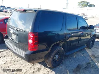 2012 Chevrolet Tahoe Commercial with VIN 1GNLC2E04CR191339, listed as a IAAI auction lot 41642943 with 152,941 mi miles. Bid and sale history available at carsss.com. Image 4.