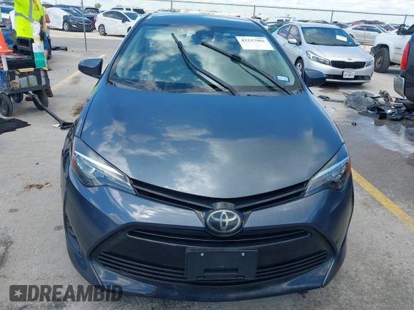 2018 Toyota Corolla L with VIN 5YFBURHE1JP832911, listed as a IAAI auction lot 42237901 with 92,158 mi miles and . Bid and sale history available at DreamBid. Image 12.