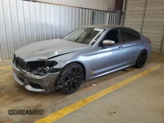 2018 BMW 5 Series M550i xDrive with VIN WBAJB9C55JB050213, listed as a Copart auction lot 61714255 with 34,700 mi miles and Salvage title. Bid and sale history available at DreamBid. Image 1.