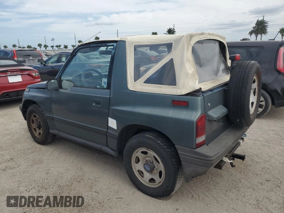 1994 Geo Tracker z VIN 2CNBE18U1R6918878, wystawiony jako Copart lot #75894834 z przebiegiem Nie podano mil oraz Nie do naprawy. Historia ofert i sprzedaży dostępna na DreamBid. Obrazek 2.