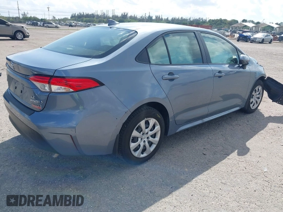 2023 Toyota Corolla Hybrid LE with VIN JTDBCMFE8PJ010693, listed as a IAAI auction lot 41736641 with 10,751 mi miles. Bid and sale history available at carsss.com. Image 4.
