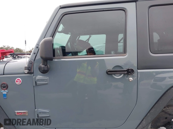 2013 Jeep Wrangler Rubicon 10th Anniversary with VIN 1C4BJWCG2DL651815, listed as a IAAI auction lot 41643919 with 98,297 mi miles and . Bid and sale history available at DreamBid. Image 14.