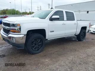 2018 Chevrolet Silverado 1500 LT with VIN 3GCPCREC7JG402401, listed as a IAAI auction lot 41880462 with 128,995 mi miles and . Bid and sale history available at DreamBid. Image 2.