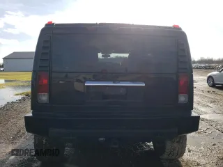 2005 Hummer H2 SUV with VIN 5GRGN23U35H111403, listed as a Copart auction lot 84720994 with 142,159 mi miles and Salvage Title. Bid and sale history available at carsss.com. Image 6.