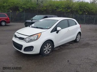 2013 Kia Rio SX with VIN KNADN5A34D6245263, listed as a IAAI auction lot 41976166 with 101,438 mi miles. Bid and sale history available at carsss.com. Image 2.