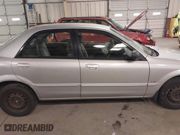 2000 Mazda Protege DX with VIN JM1BJ2226Y0206340, listed as a IAAI auction lot 41645396 with 238,500 mi miles and . Bid and sale history available at DreamBid. Image 13.