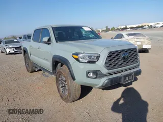2022 Toyota Tacoma SR with VIN 3TMCZ5AN7NM501028, listed as a IAAI auction lot 42537868 with 42,186 mi miles and . Bid and sale history available at DreamBid. Image 1.