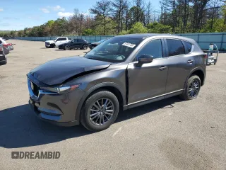 2021 Mazda CX-5 Touring z VIN JM3KFBCM3M1338050, wystawiony jako Copart lot #57461765 z przebiegiem 24 147 mil mil oraz Szkody całkowita. Historia ofert i sprzedaży dostępna na DreamBid. Obrazek 1.