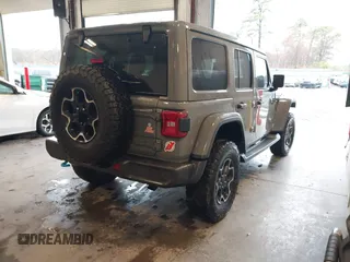 2021 Jeep Wrangler Unlimited Rubicon z VIN 1C4JJXR65MW675010, wystawiony jako IAAI lot #41990021 z przebiegiem 73 406 mil mil oraz . Historia ofert i sprzedaży dostępna na DreamBid. Obrazek 4.