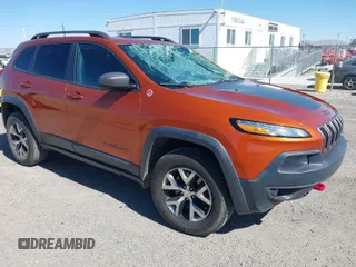2016 Jeep Cherokee Trailhawk with VIN 1C4PJMBS8GW176464, listed as a IAAI auction lot 41656518 with 63,724 mi miles. Bid and sale history available at carsss.com. Image 1.