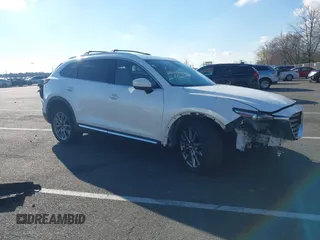 2018 Mazda CX-9 Grand Touring with VIN JM3TCBDY6J0200843, listed as a IAAI auction lot 40971233 with 94,770 mi miles and . Bid and sale history available at DreamBid. Image 1.