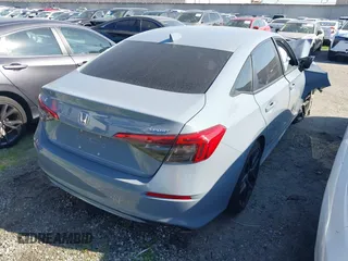 2023 Honda Civic Sport z VIN 2HGFE2F50PH556813, wystawiony jako IAAI lot #41364523 z przebiegiem 8 999 mil mil oraz . Historia ofert i sprzedaży dostępna na DreamBid. Obrazek 4.