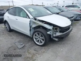 2023 Tesla Model Y Long Range z VIN 7SAYGDEE9PF623285, wystawiony jako IAAI lot #41383184 z przebiegiem 34 092 mil mil oraz . Historia ofert i sprzedaży dostępna na DreamBid. Obrazek 1.