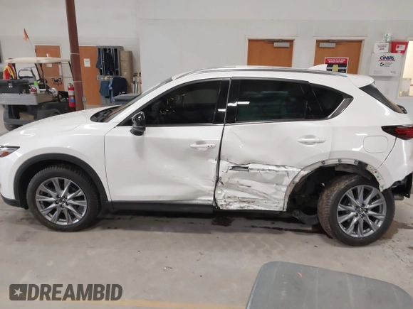 2020 Mazda CX-5 Grand Touring with VIN JM3KFBDM6L1828611, listed as a IAAI auction lot 42006976 with 59,939 mi miles and . Bid and sale history available at DreamBid. Image 15.