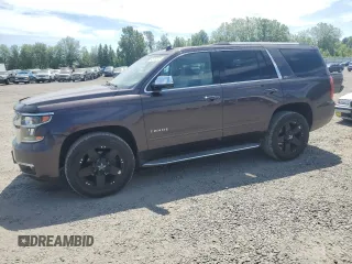 2015 Chevrolet Tahoe LTZ with VIN 1GNSKCKC7FR194792, listed as a Copart auction lot 65783725 with 213,828 mi miles and Clean title. Bid and sale history available at DreamBid. Image 1.