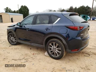2019 Mazda CX-5 Grand Touring with VIN JM3KFADM0K1596256, listed as a Copart auction lot 86323594 with 118,853 mi miles and Salvage title. Bid and sale history available at DreamBid. Image 2.