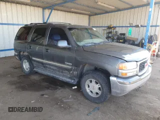 2001 GMC Yukon SLT z VIN 1GKEK13T21J165558, wystawiony jako Copart lot #52200565 z przebiegiem 291 699 mil mil oraz Szkoda całkowita • Salvage title. Historia ofert i sprzedaży dostępna na DreamBid. Obrazek 4.
